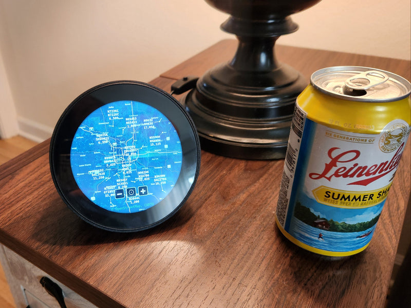 SkyWatch circular display on a desk